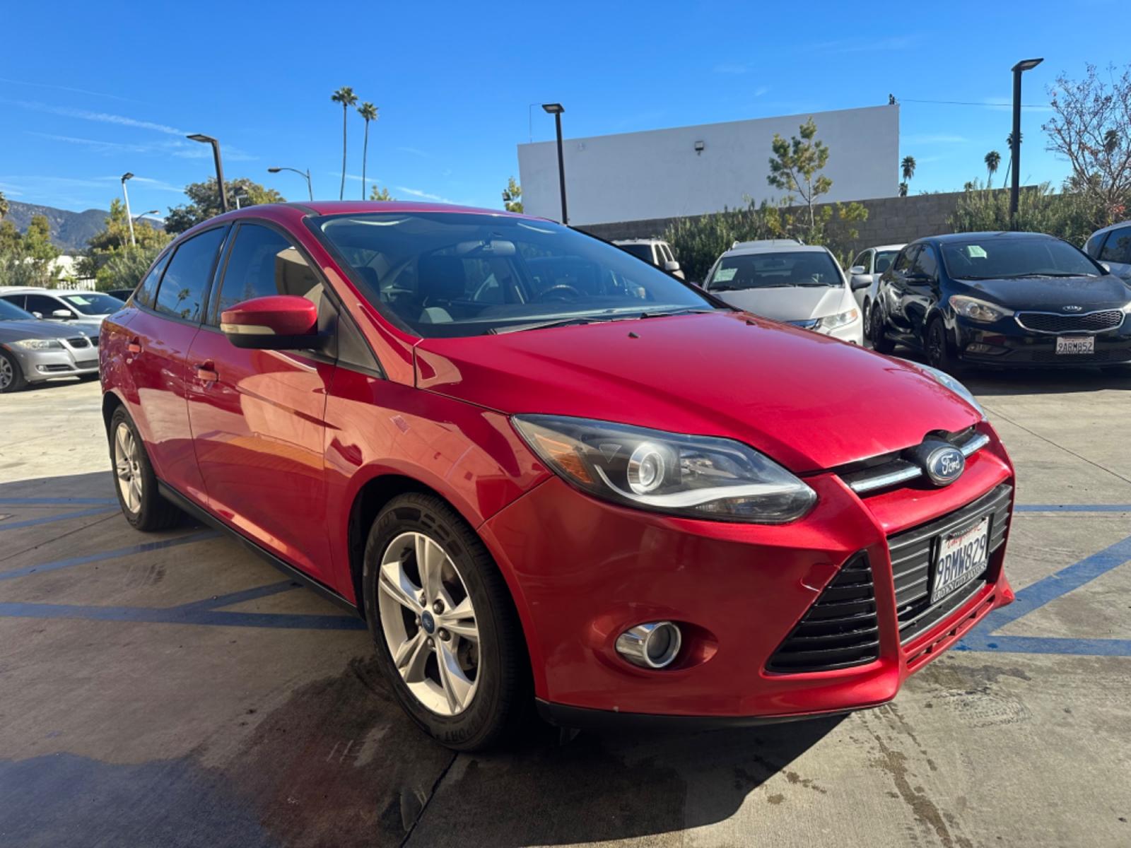 2012 RED /BLACK Ford Focus SE Sedan (1FAHP3F29CL) with an 2.0L L4 DOHC 16V engine, AUTOMATIC transmission, located at 30 S. Berkeley Avenue, Pasadena, CA, 91107, (626) 248-7567, 34.145447, -118.109398 - New Tires! Nice Interior! drives and looks good! Bad credit? We can help! We are the bank. All our cars are thoroughly inspected and reconditioned by our technicians. FREE CARFAX report. Stop by or call to speak with our friendly staff. Whether you have bad credit, no credit, bankruptcy, or reposse - Photo #6